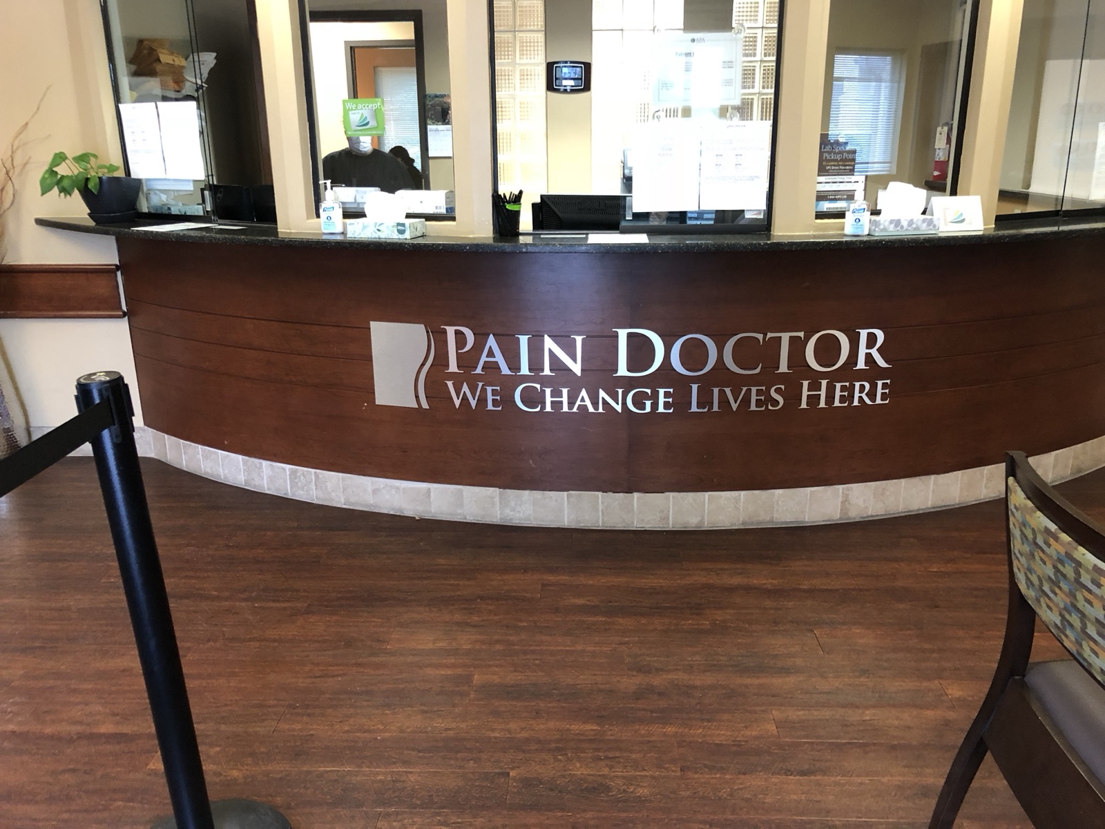 Dimensional letters mounted on a reception desk front, installed by E&A Signs